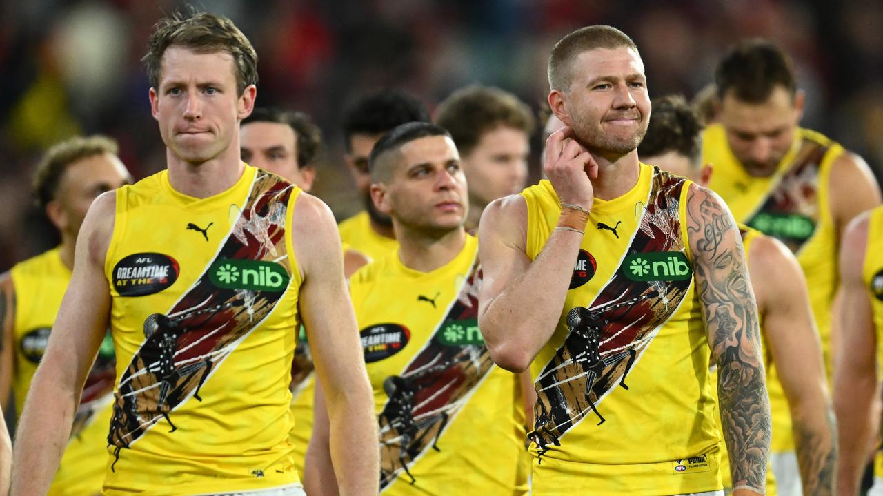 MELBOURNE, AUSTRALIA – MAY 20: Dylan Grimes and his Tigers teammates look dejected after losing the round 10 AFL match between Essendon Bombers and Richmond Tigers at Melbourne Cricket Ground, on May 20, 2023, in Melbourne, Australia. (Photo by Quinn Rooney/Getty Images)