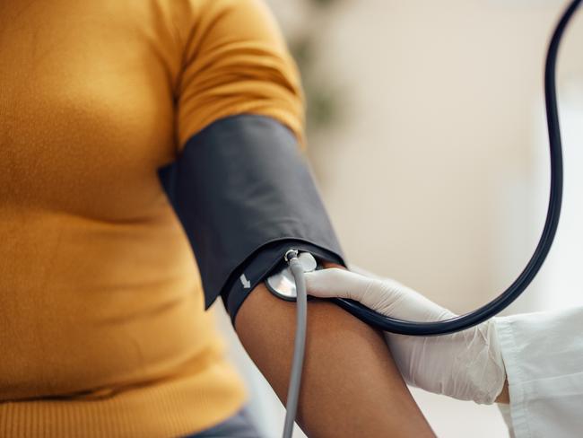 Measuring blood pressure with blood pressure manometer, sphygmomanometer.