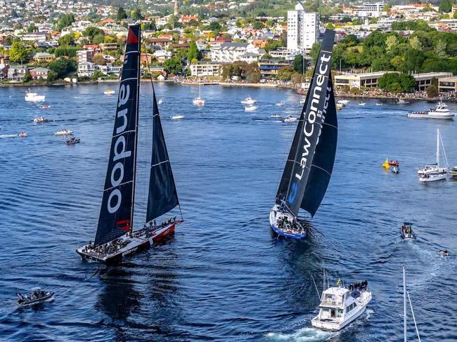 TOPSHOT - This handout image received from Rolex on December 28, 2023 shows yachts Law Connect and Andoo Comanche near the finish line of the annual Sydney to Hobart yacht race in Hobart. (Photo by Andrea Francolini / AFP) / RESTRICTED TO EDITORIAL USE - MANDATORY CREDIT "AFP PHOTO / ROLEX / ANDREA FRANCOLINI" - NO MARKETING NO ADVERTISING CAMPAIGNS - DISTRIBUTED AS A SERVICE TO CLIENTS - NO ARCHIVE