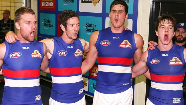 Boys celebrates a win with Jake Stringer, Murphy and Liam Picken. Picture: Getty Images