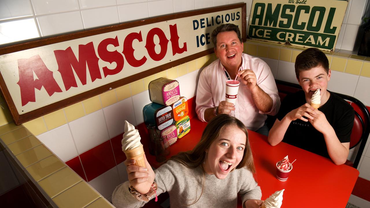 Steward Kay (proprietor of AMSCOL) with Jessica Kay, 14, and Joshua Baker, 12, celebrate the return of AMSCOL Ice Cream.