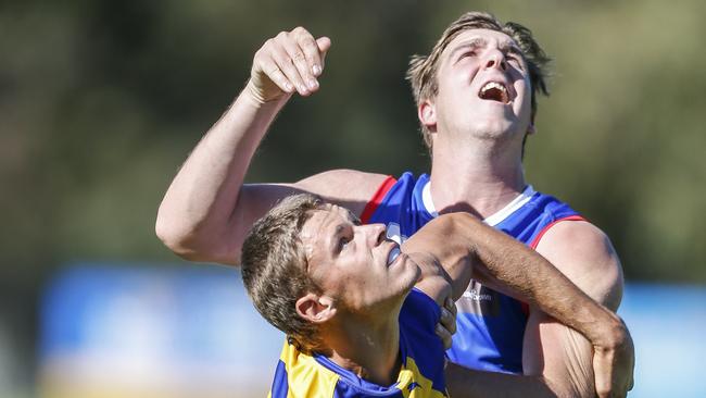 Jake Gains and Max King tangle in the ruck on Saturday. Picture: Valeriu Campan