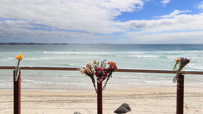 Flowers at the scene of Tuesday’s fatal shark attack at Greenmount point. Photo: Scott Powick Newscorp