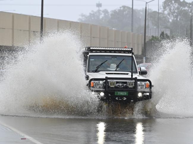 Flooded road Shailer road in Shailer Park. Picture, John Gass