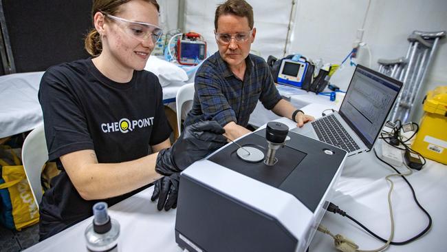 CEO of The Loop Australia Cameron Francis and chemist Madeline Harding with a ATR instrument that will test pills and powders for the duration of the Schoolies festival on the Gold Coast. Picture: Nigel Hallett