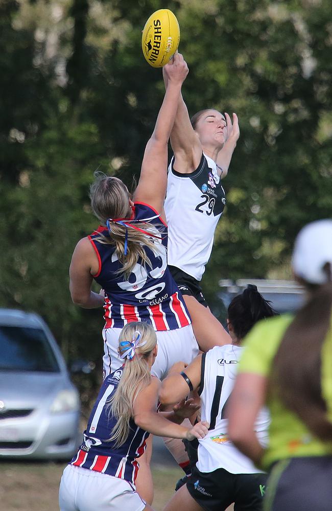 Action shots of Southport Sharks v Wilston Grange QAFLW. Southport Player No29 Lilly Pearce Wilston Grange Player No33 Ella Smith Pic Mike Batterham