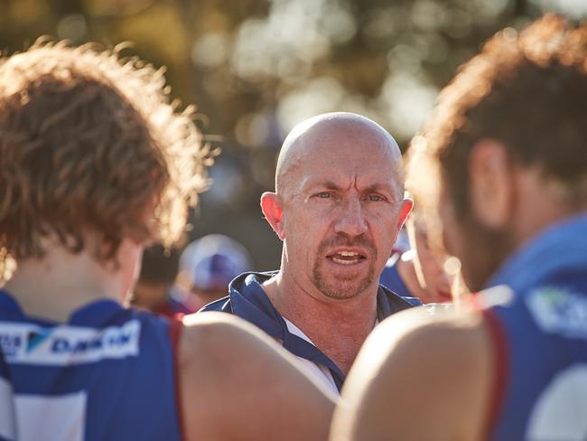 Central Bulldogs Coach Roy Laird talking to players at quarter time in the Crows vs Bulldogs match in Elizabeth, Saturday, April 21, 2018. (AAP Image/MATT LOXTON)