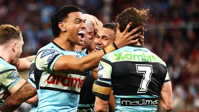 BRISBANE, AUSTRALIA - MAY 18: Ronaldo Mulitalo and Nicho Hynes of the Sharks celebrate a try during the round 11 NRL match between Cronulla Sharks and Sydney Roosters at Suncorp Stadium, on May 18, 2024, in Brisbane, Australia. (Photo by Chris Hyde/Getty Images)