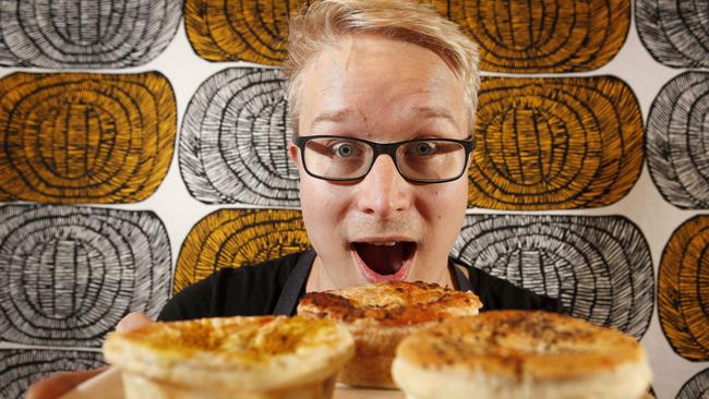 Swedish Tarts Patiserrie employee Lauri Kirves with a selection of pies. Picture: Bianca De Marchi