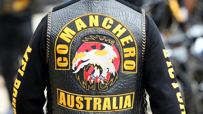 An alleged Comanchero associate has been charged with intimidating his ex-wife.