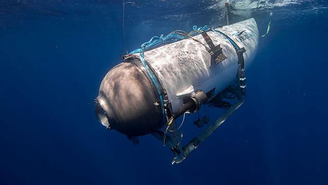 This undated image courtesy of OceanGate Expeditions, shows their Titan submersible beginning a descent. Rescue teams expanded their search underwater on June 20, 2023, as they raced against time to find a Titan deep-diving tourist submersible that went missing near the wreck of the Titanic with five people on board and limited oxygen. All communication was lost with the 21-foot (6.5-meter) Titan craft during a descent June 18 to the Titanic, which sits at a depth of crushing pressure more than two miles (nearly four kilometers) below the surface of the North Atlantic. (Photo by Handout / OceanGate Expeditions / AFP) / RESTRICTED TO EDITORIAL USE - MANDATORY CREDIT "AFP PHOTO / OceanGate Expeditions" - NO MARKETING NO ADVERTISING CAMPAIGNS - DISTRIBUTED AS A SERVICE TO CLIENTS