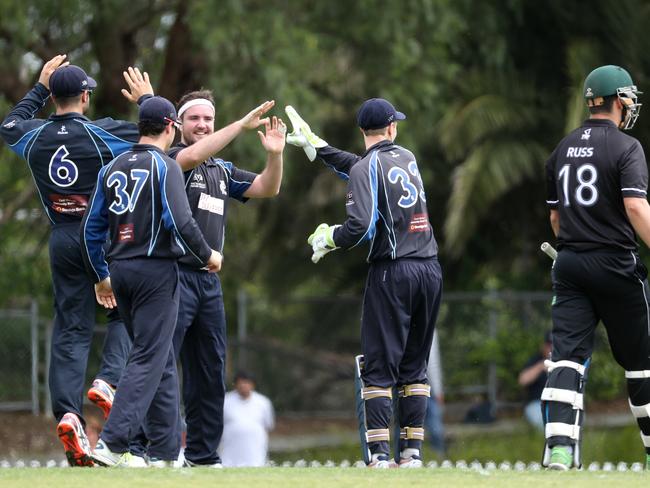 Prahran celebrate the wicket of Camberwell captain Tom Russ. Picture: Mark Dadswell