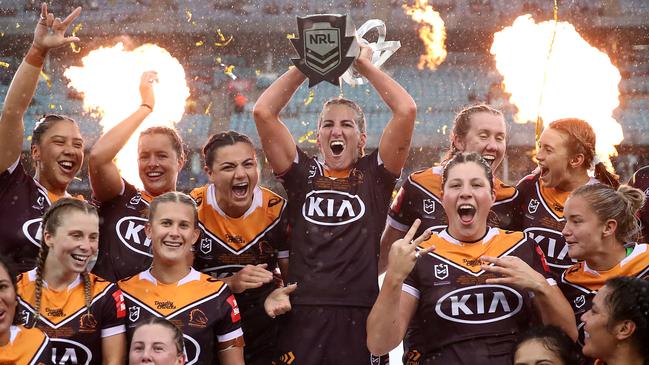 Broncos captain Ali Brigginshaw holds aloft the NRLW premiership trophy as she celebrates with teammates after winning the grand final Picture: Getty Images