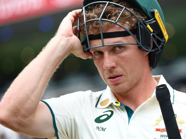 BRISBANE, AUSTRALIA - DECEMBER 18: Nathan McSweeney of Australia prepares to bat before play being delayed during day five of the Third Test match in the series between Australia and India at The Gabba on December 18, 2024 in Brisbane, Australia. (Photo by Chris Hyde/Getty Images)