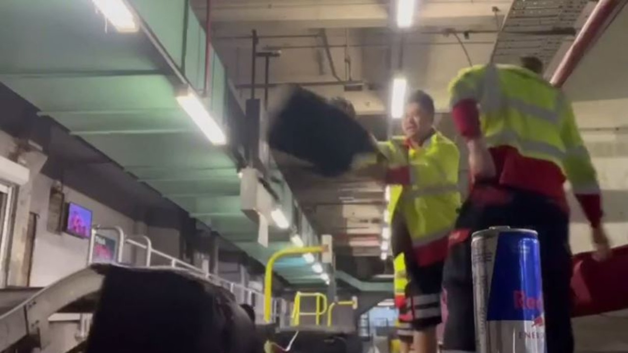 Two Melbourne Airport baggage handlers have been sacked after they were filmed throwing and slamming bags. Picture: TikTok