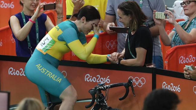 A shattered Anna Meares with her former adversary Victoria Pendleton from Great Britain.