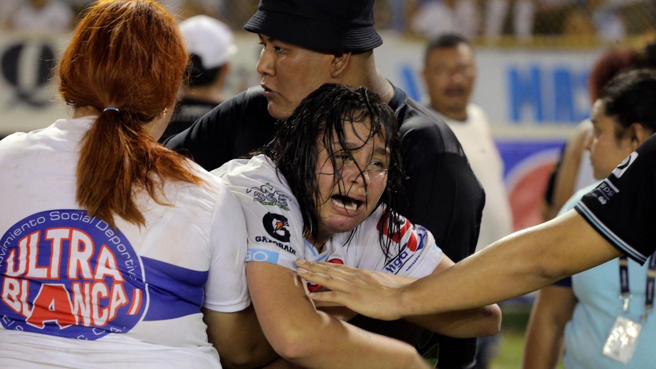 At least 12 dead in horrific stadium stampede