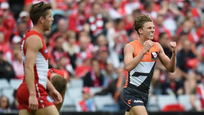 Lachie Whitfield celebrates a goal against Sydney.