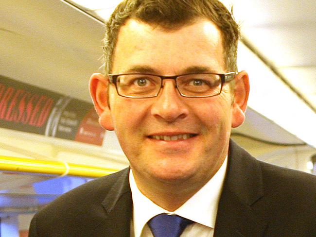 State Opposition leader Daniel Andrews with MP Jill Hennessy on the Melbourne to Geelong train speaking to passengers. Picture: Greg Dundas.