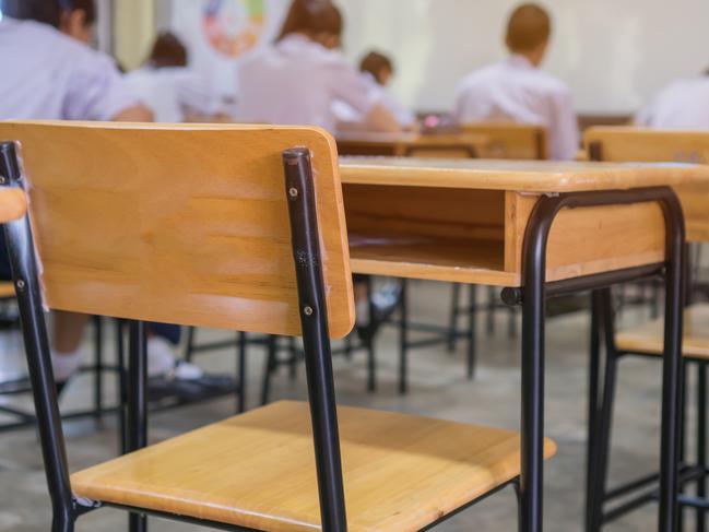 Lecture room or School empty classroom with Student taking exams, writing examination for studying lessons in high school thailand, interior of secondary education, whiteboard. educational concept