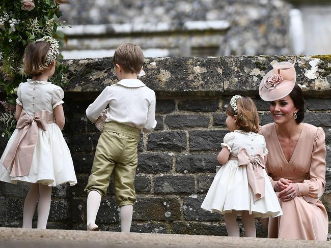 Kate stands with her daughter princess Charlotte after leaving the church.