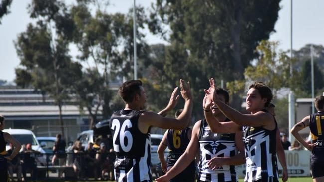 Moama celebrate one of Tobias Hore's five goals against Echuca United. Photo: Moama Football Netball Club.