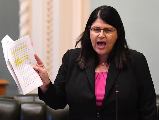 Queensland Education minister Grace Grace addresses a reduced chamber, due to social distancing measures, during Question Time at Queensland Parliament in Brisbane, Wednesday, April 22, 2020. Queensland has recorded no new cases of coronavirus in the past 24 hours. (AAP Image/Dan Peled) NO ARCHIVING