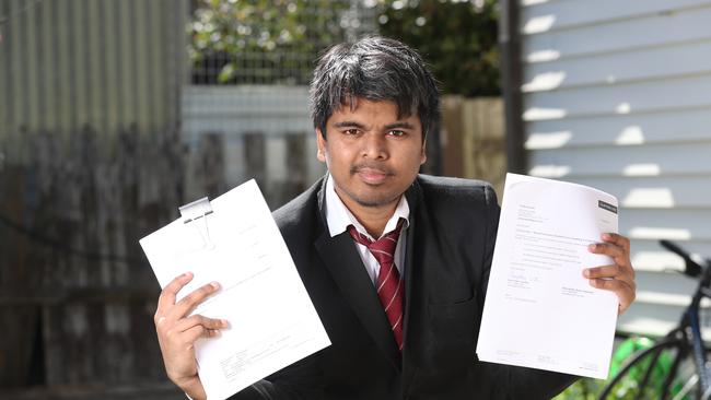 Mr Naik with his court documents, pictured in September. Picture: Alex Coppel