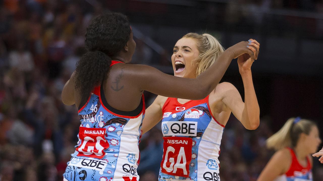 Helen Housby and Swifts teammate Sam Wallace celebrate a win. Picture: Craig Golding