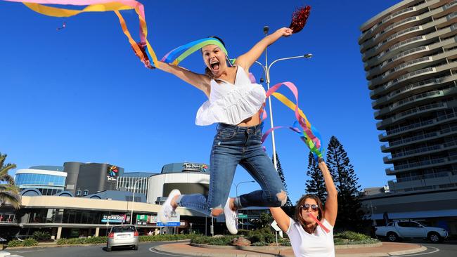 Amy Van den Akker jumps for joy off the closed Queensland Border barricades while her mother Wendy Van den Akker cheers on. Photo: Scott Powick Newscorp