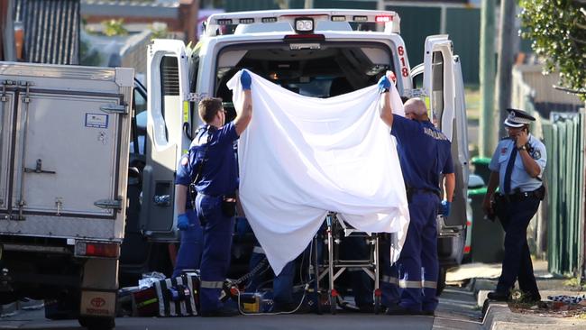 Police and Ambulance respond at the scene of a shooting on Redman Lane, Belmore. Picture: Richard Dobson