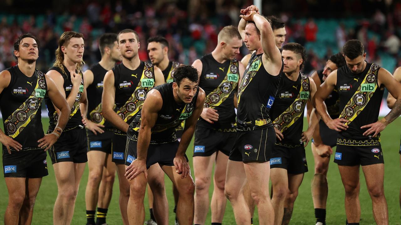 Dejected Tigers players try to come to terms with their controversial defeat in Sydney. Picture: Cameron Spencer/AFL Photos/via Getty Images