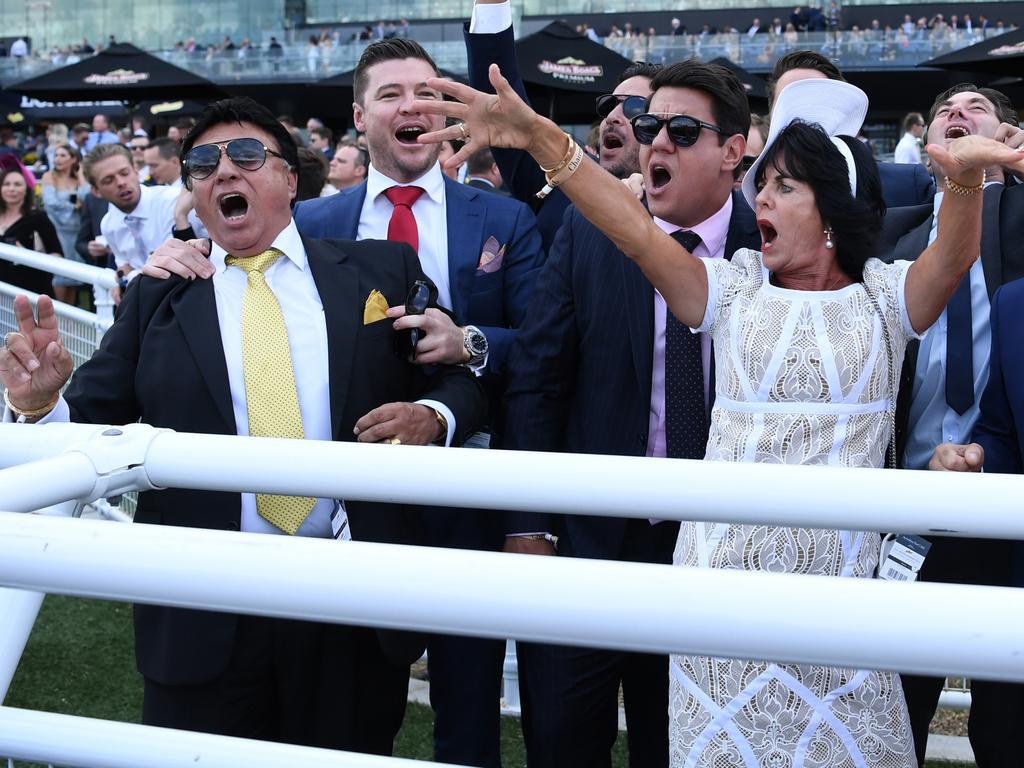 Bert Vieira (left) and the owners of Trapeze Artist celebrate after it won race 7, the Schweppes All Aged Stakes during the All Aged Stakes Day at Royal Randwick racecourse in Sydney, Saturday, April 21, 2018. (AAP Image/David Moir) NO ARCHIVING, EDITORIAL USE ONLY