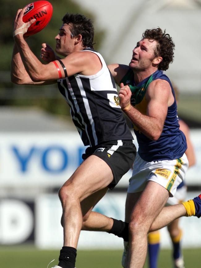 Jordan Barham taking a mark for Port Adelaide in the SANFL.