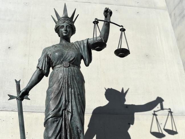 A statue of Themis, the Greek God of Justice stands outside the Supreme Court in Brisbane, Thursday, Oct. 20, 2016. (AAP Image/Dave Hunt) NO ARCHIVING