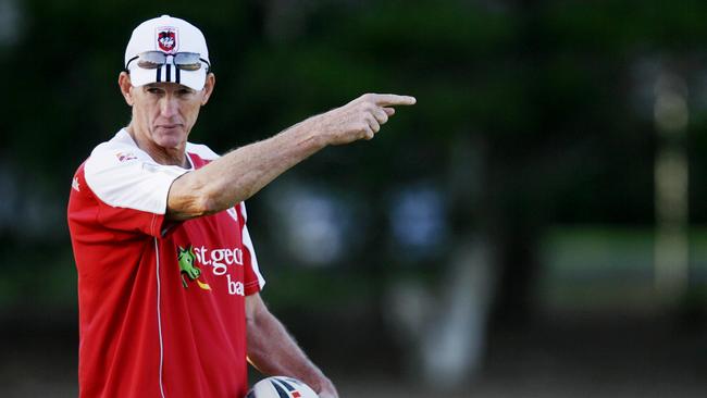 New coach Wayne Bennett instructs his players during St George-Illawarra Dragons NRL team pre-season training at Wollongong University oval in Wollongong.