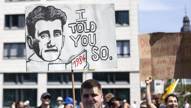 Protestor holding up a banner during a demonstration in the city centre of Frankfurt, Germany.