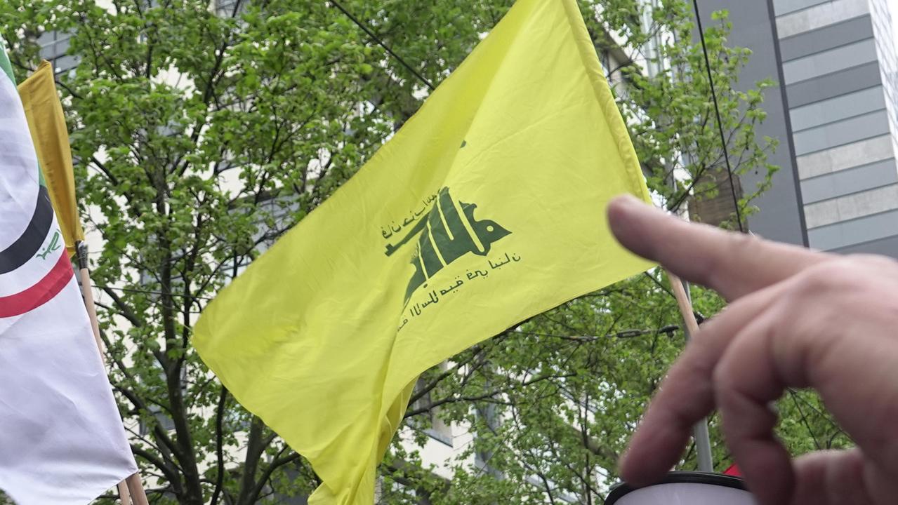 Protester allegedly waves terrorist flag