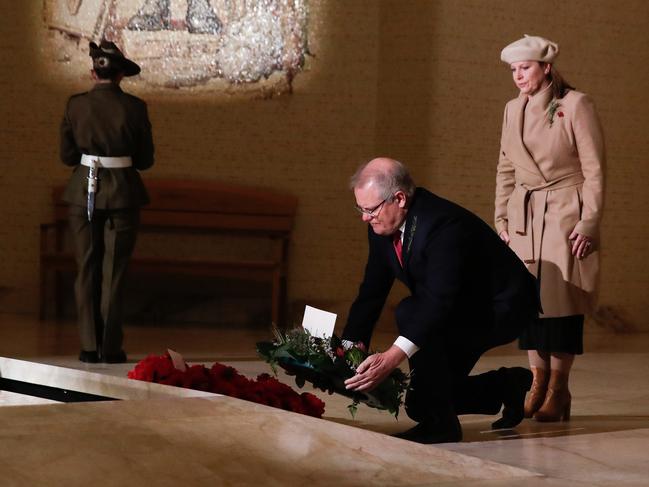 Prime Minister Scott Morrison and Jenny Morrison lay a wreath at the Tomb of the Unknown Australian Soldier during the Anzac Day commemorative service at the Australian War Memorial. Picture: Getty