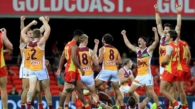 Brisbane celebrate winning the season’s first QClash. Picture: Adam Head