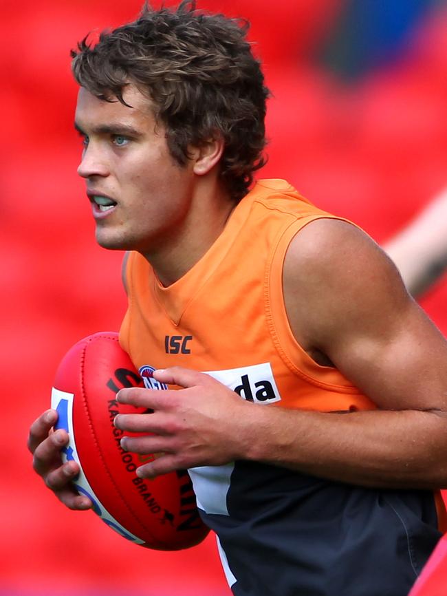 Alex Carey takes possession for GWS during a game against Gold Coast.