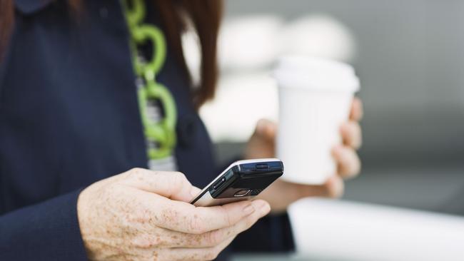 Woman dialing mobile phone.