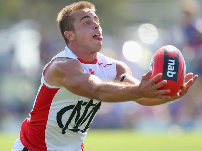 Ben Kennedy stretches for a mark during a Melbourne intra-club game.