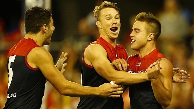 Melbourne celebrates a big win over Gold Coast in Round 7.