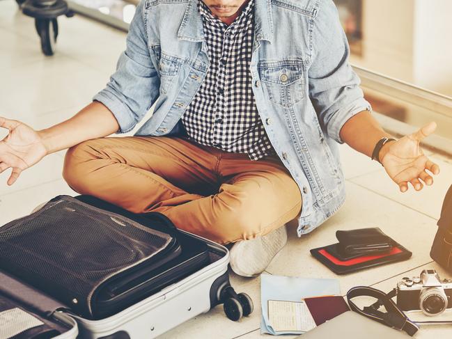 An Asian male traveler is experiencing the problem of need and lost value at the airport.