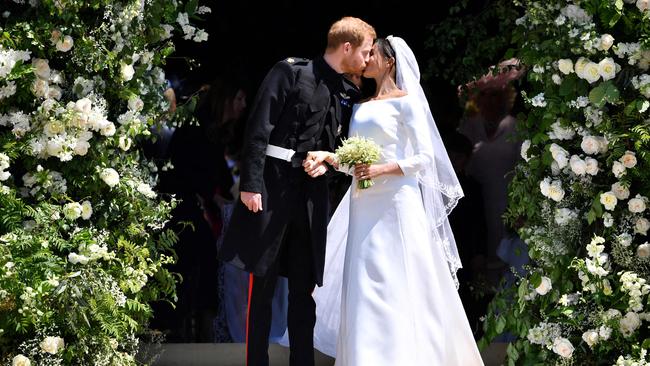 Harry and Meghan as they leave from the West Door of St George's Chapel at Windsor Castle in Windsor after their wedding ceremony. Picture: Ben Stansall/Pool/AFP