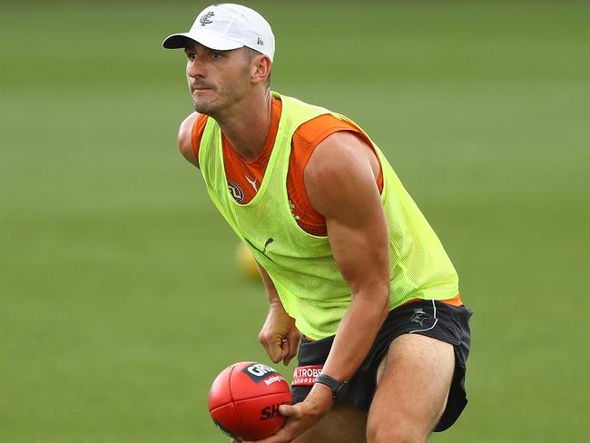 MELBOURNE, AUSTRALIA - JANUARY 15: Marc Pittonet of the Blues handballs during a Carlton Blues AFL training session at Ikon Park on January 15, 2021 in Melbourne, Australia. (Photo by Robert Cianflone/Getty Images)
