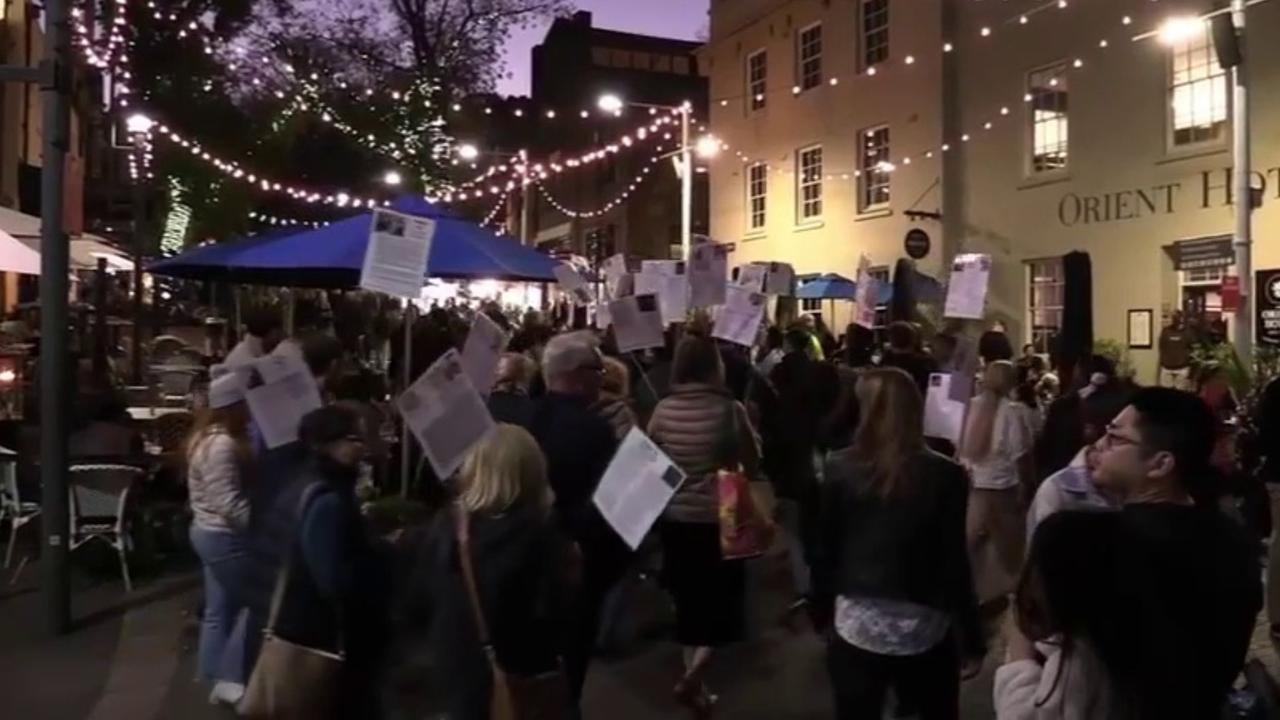 The group paraded their signs through The Rocks during Vivid festivities. Picture: Facebook