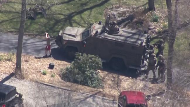 National guardsman Jack Teixeira taken into custody by FBI agents in a forested area in North Dighton. Picture: AFP