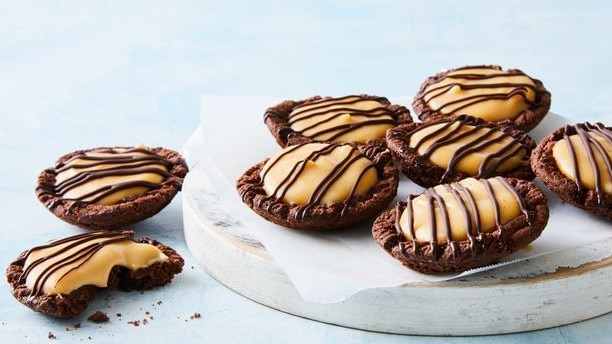 Just use five ingredients for these Caramilk custard tarts. Picture: Supplied